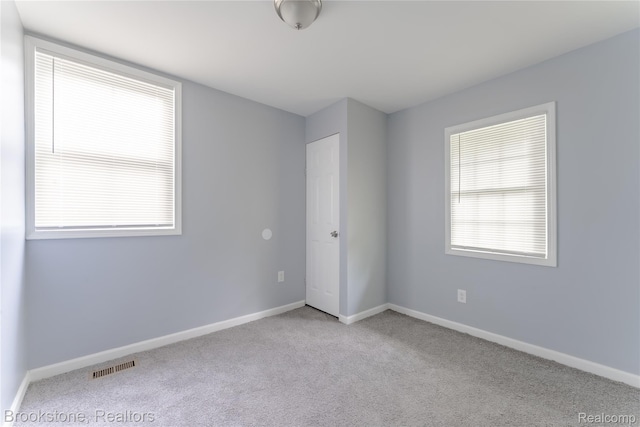 853 Melrose St, Pontiac, MI 48340 - unfurnished bedroom featuring carpet and multiple windows