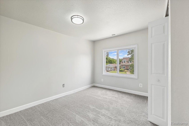 3140 Moore St, Inkster, MI 48141 - carpeted empty room with a textured ceiling and baseboards