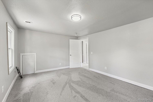 3140 Moore St, Inkster, MI 48141 - unfurnished room featuring a textured ceiling and carpet flooring
