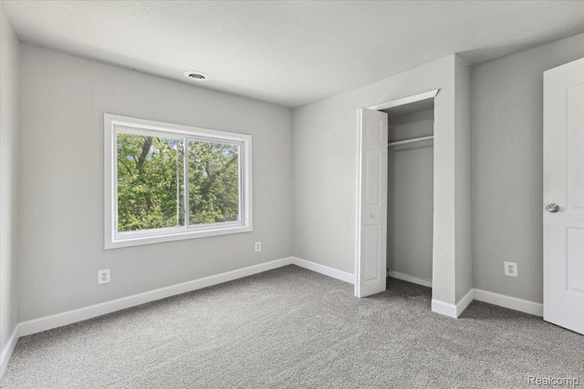 3140 Moore St, Inkster, MI 48141 - unfurnished bedroom with carpet floors, a closet, and a textured ceiling