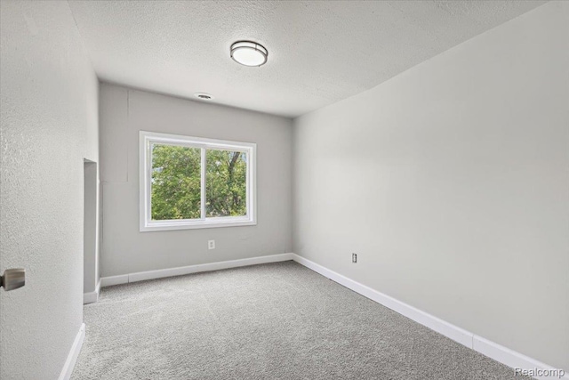 3140 Moore St, Inkster, MI 48141 - spare room with carpet floors and a textured ceiling