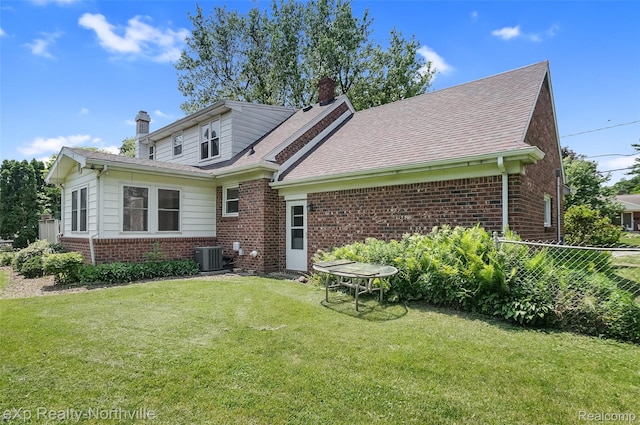 517 S Scott St, Adrian, MI 49221 - rear view of house with a chimney and brick siding