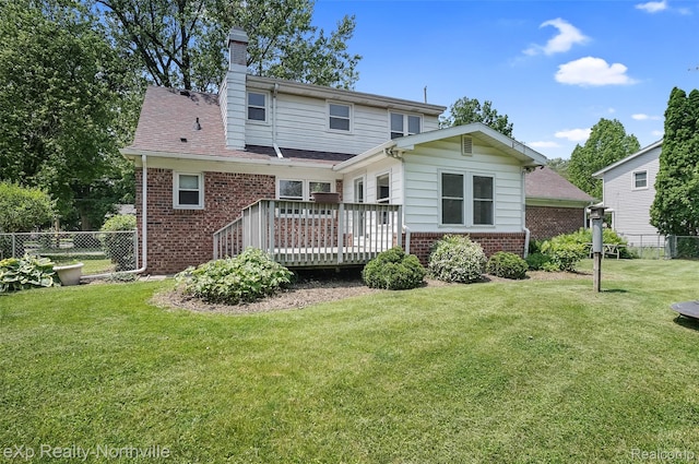 517 S Scott St, Adrian, MI 49221 - back of property with brick siding, a wooden deck, and a chimney