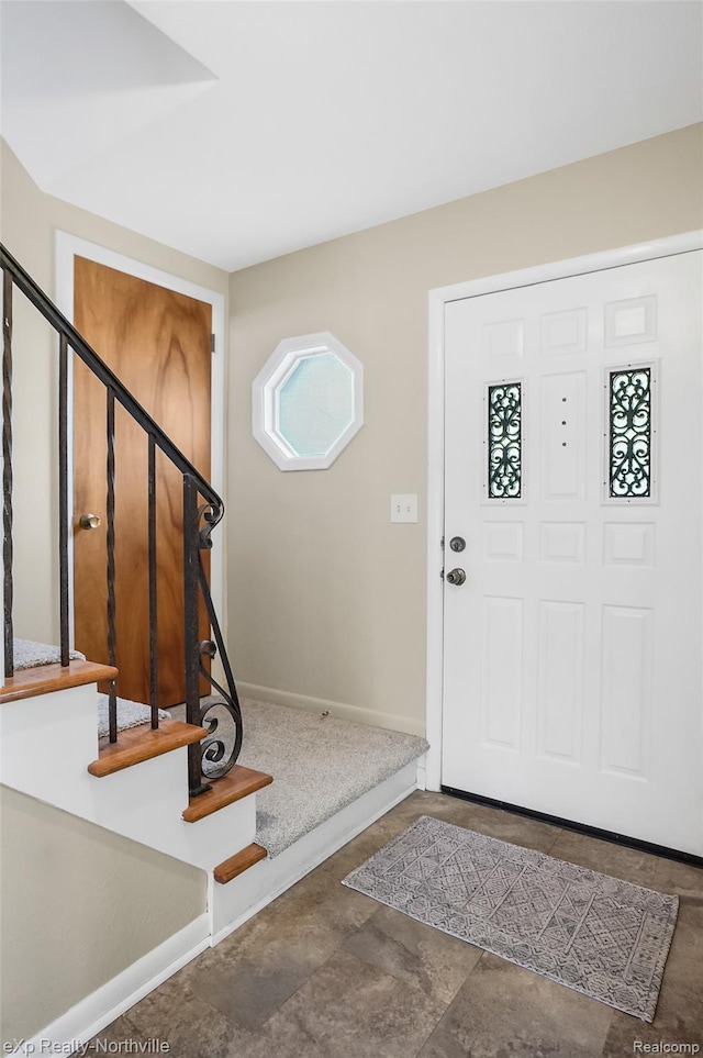 517 S Scott St, Adrian, MI 49221 - entrance foyer featuring stairway and baseboards