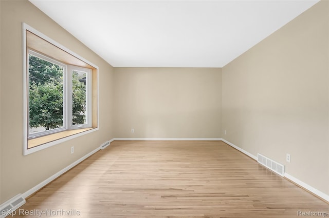 517 S Scott St, Adrian, MI 49221 - unfurnished room featuring light wood-style floors