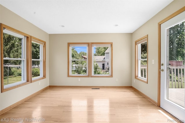 517 S Scott St, Adrian, MI 49221 - unfurnished room with light wood-style floors and baseboards