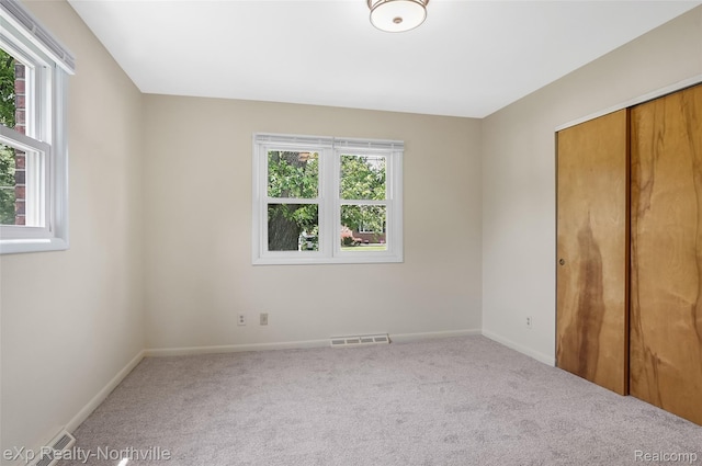 517 S Scott St, Adrian, MI 49221 - unfurnished bedroom with carpet and a closet