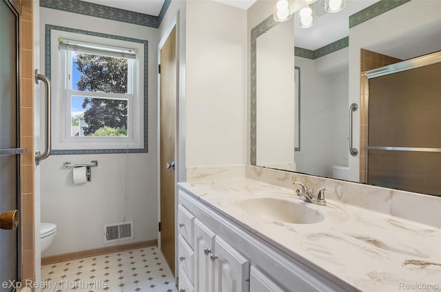 517 S Scott St, Adrian, MI 49221 - full bathroom featuring vanity and a shower with shower door