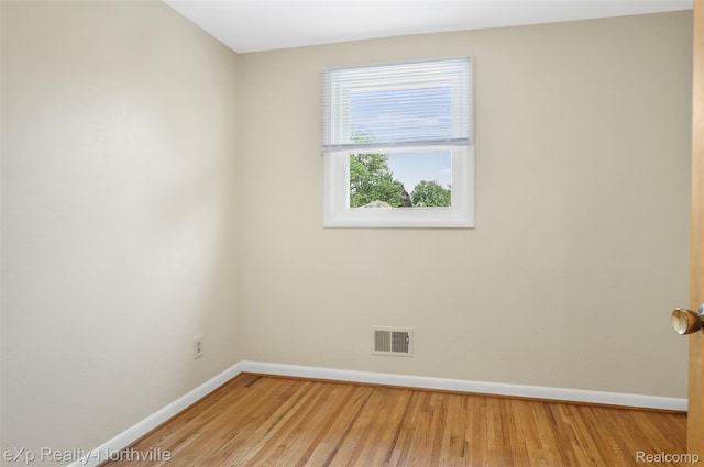 517 S Scott St, Adrian, MI 49221 - unfurnished room with baseboards and wood finished floors