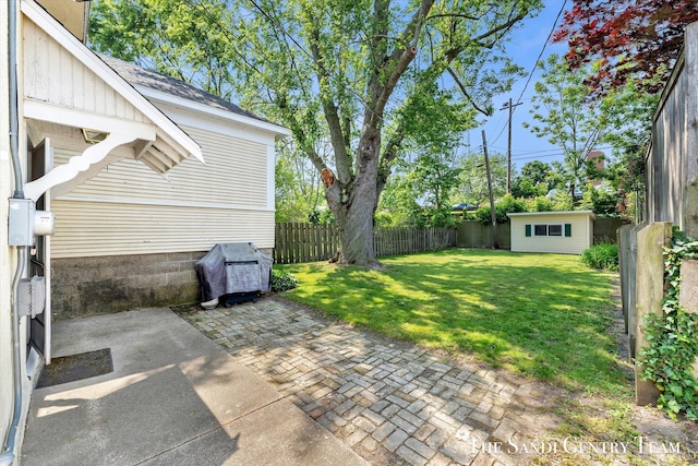 508 Fulton St, Grand Haven, MI 49417 - fenced backyard with a patio area and an outbuilding