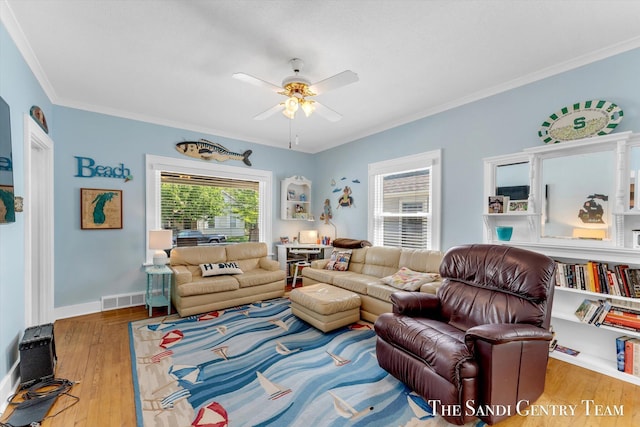 508 Fulton St, Grand Haven, MI 49417 - living area with ceiling fan, crown molding, and wood finished floors