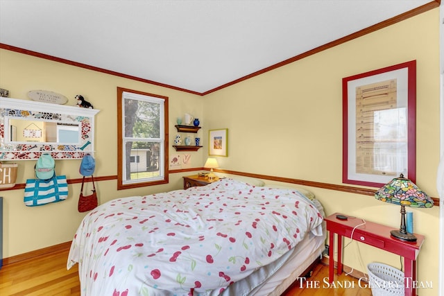 508 Fulton St, Grand Haven, MI 49417 - bedroom featuring wood finished floors and ornamental molding
