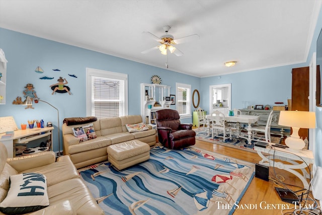 508 Fulton St, Grand Haven, MI 49417 - living room featuring ceiling fan, wood finished floors, and crown molding