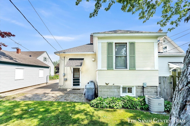 508 Fulton St, Grand Haven, MI 49417 - back of property with a patio
