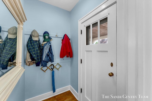 508 Fulton St, Grand Haven, MI 49417 - doorway to outside with baseboards and wood finished floors