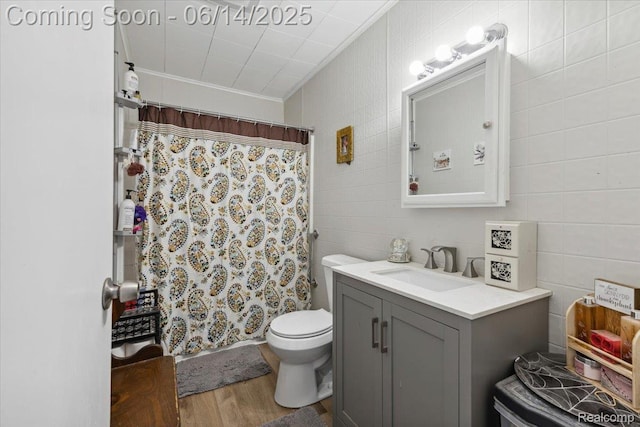 1386 Proper Ave, Burton, MI 48529 - full bathroom featuring vanity, wood finished floors, tile walls, a shower with curtain, and ornamental molding