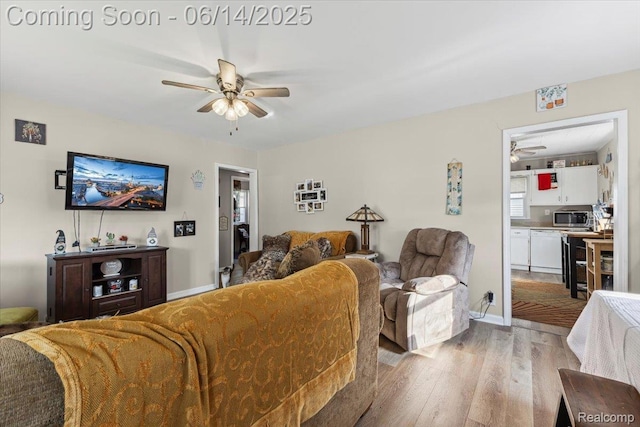 1386 Proper Ave, Burton, MI 48529 - living area featuring a ceiling fan and wood finished floors