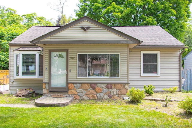 21110 Van Buren St, Southfield, MI 48033 - bungalow featuring roof with shingles and stone siding