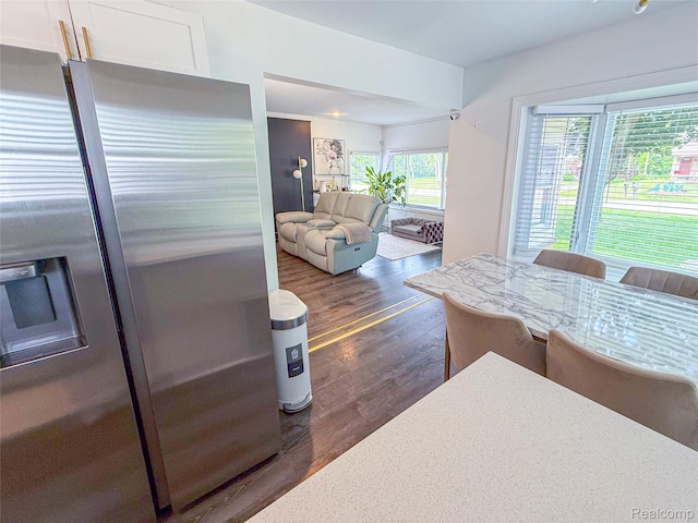 21110 Van Buren St, Southfield, MI 48033 - kitchen with stainless steel refrigerator with ice dispenser, dark wood-type flooring, light countertops, and white cabinets