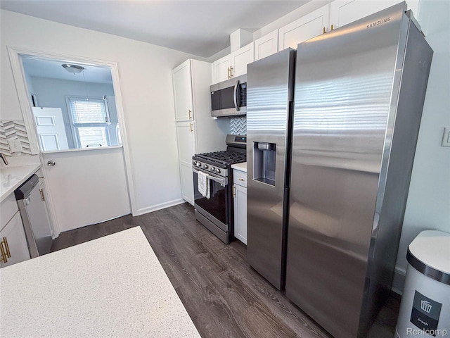 21110 Van Buren St, Southfield, MI 48033 - kitchen with stainless steel appliances, dark wood-style floors, light countertops, decorative backsplash, and white cabinetry