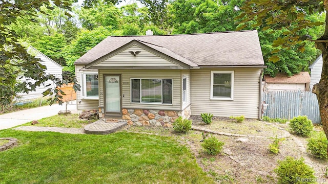 21110 Van Buren St, Southfield, MI 48033 - bungalow-style house with roof with shingles and stone siding