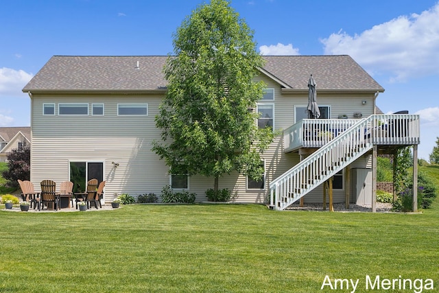 1824 Restoration Dr SW, Byron Center, MI 49315 - back of house with stairs, a deck, a lawn, and a shingled roof