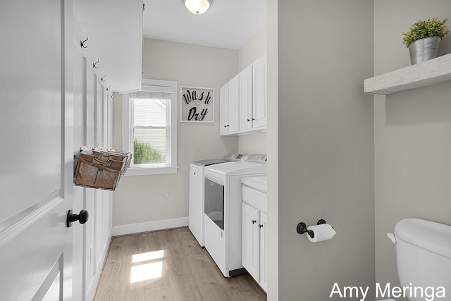 1824 Restoration Dr SW, Byron Center, MI 49315 - laundry area featuring washing machine and clothes dryer and light wood-style flooring