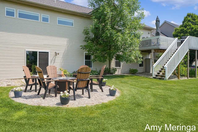 1824 Restoration Dr SW, Byron Center, MI 49315 - rear view of property with stairs, a deck, a fire pit, and a lawn
