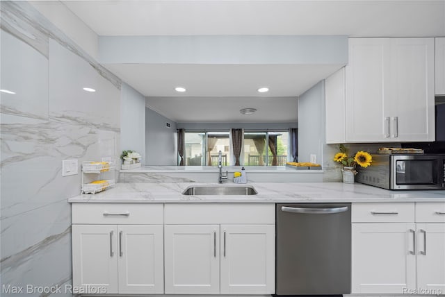 29656 Brentwood St, Southfield, MI 48076 - kitchen featuring appliances with stainless steel finishes, white cabinetry, light stone counters, tasteful backsplash, and recessed lighting
