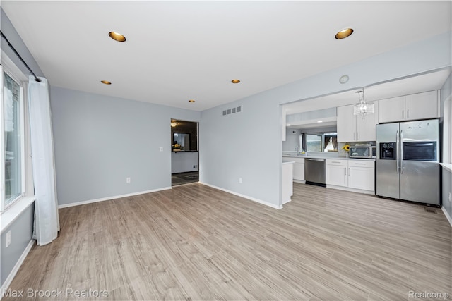 29656 Brentwood St, Southfield, MI 48076 - unfurnished living room featuring light wood-type flooring and recessed lighting