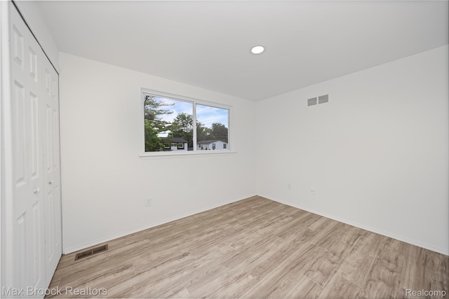 29656 Brentwood St, Southfield, MI 48076 - unfurnished bedroom with a closet, light wood-type flooring, and recessed lighting