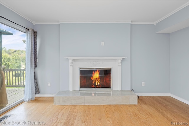 29656 Brentwood St, Southfield, MI 48076 - detailed view of wood finished floors, crown molding, and a tiled fireplace