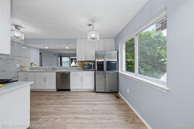 29656 Brentwood St, Southfield, MI 48076 - kitchen with appliances with stainless steel finishes, a chandelier, healthy amount of natural light, and recessed lighting