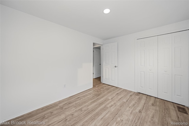 29656 Brentwood St, Southfield, MI 48076 - unfurnished bedroom featuring wood finished floors, a closet, and recessed lighting
