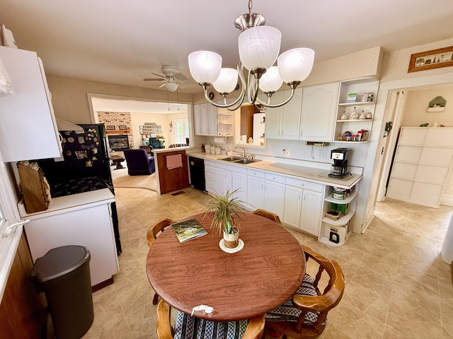 16130 Addison Rd, Addison, MI 49220 - kitchen featuring open shelves, black dishwasher, a ceiling fan, light countertops, and wallpapered walls