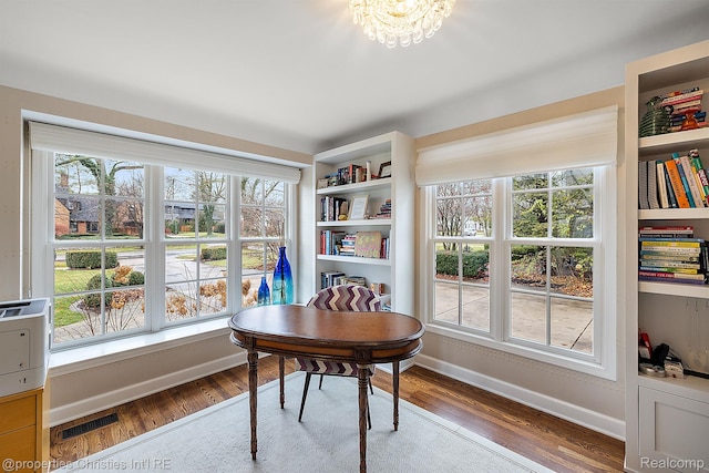 1174 Lakeside Dr, Birmingham, MI 48009 - home office with wood finished floors and a chandelier