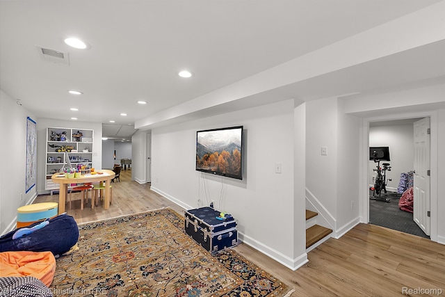 1174 Lakeside Dr, Birmingham, MI 48009 - living room featuring light wood-style flooring, stairs, and recessed lighting
