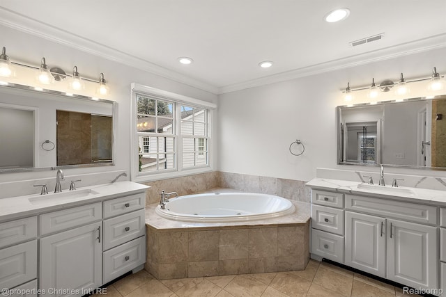1174 Lakeside Dr, Birmingham, MI 48009 - full bath featuring two vanities, a garden tub, ornamental molding, tile patterned flooring, and recessed lighting