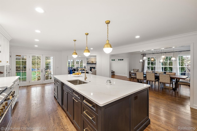 1174 Lakeside Dr, Birmingham, MI 48009 - kitchen featuring ornamental molding, dark brown cabinetry, healthy amount of natural light, wood finished floors, and recessed lighting