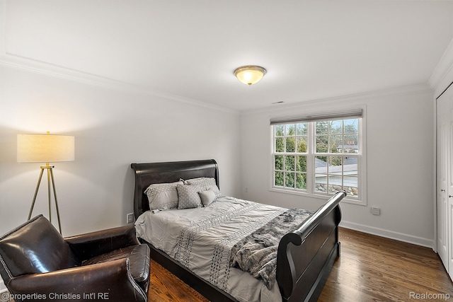 1174 Lakeside Dr, Birmingham, MI 48009 - bedroom with ornamental molding and dark wood-style floors