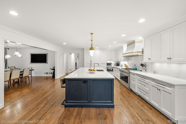 1174 Lakeside Dr, Birmingham, MI 48009 - kitchen with custom exhaust hood, appliances with stainless steel finishes, white cabinets, ornamental molding, and wood finished floors
