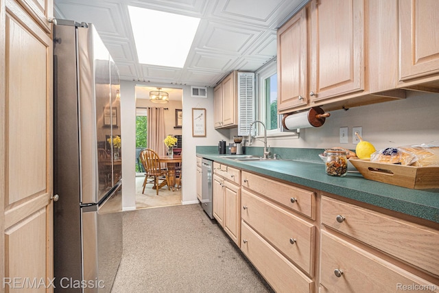 854 Yorktown Ct, Northville, MI 48167 - kitchen with stainless steel appliances, light brown cabinets, an ornate ceiling, dark countertops, and light carpet