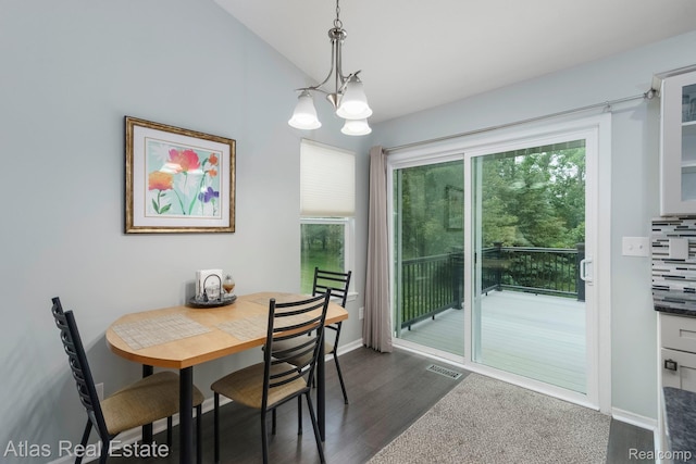 3527 Applewood Ln Unit 2, Grand Blanc, MI 48439 - dining room with a chandelier, healthy amount of natural light, dark wood-style floors, and vaulted ceiling