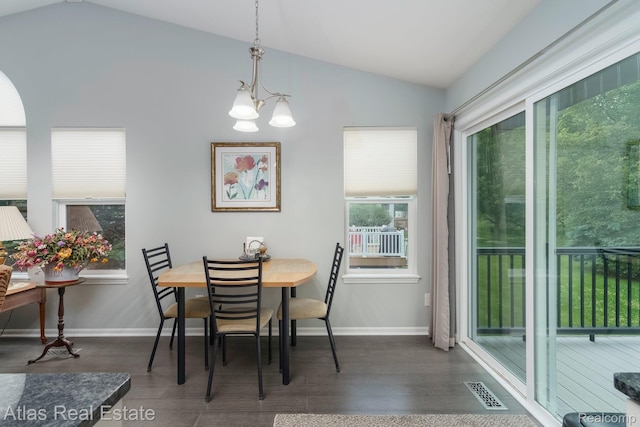 3527 Applewood Ln Unit 2, Grand Blanc, MI 48439 - dining space with vaulted ceiling, dark wood-style flooring, and a chandelier