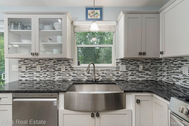 3527 Applewood Ln Unit 2, Grand Blanc, MI 48439 - kitchen with stainless steel appliances, backsplash, glass insert cabinets, pendant lighting, and dark stone counters