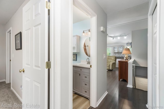 3527 Applewood Ln Unit 2, Grand Blanc, MI 48439 - corridor featuring track lighting and dark wood-style floors