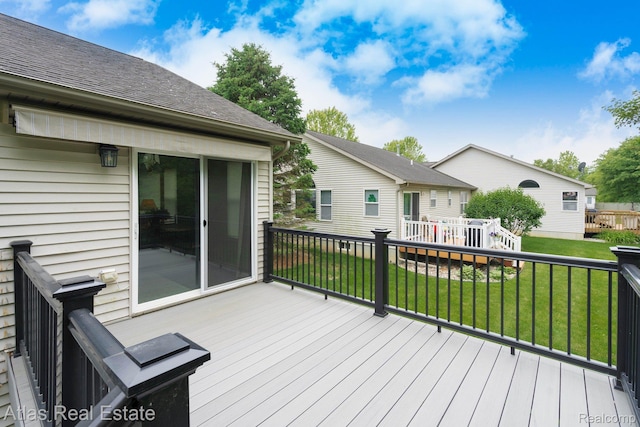 3527 Applewood Ln Unit 2, Grand Blanc, MI 48439 - deck featuring a lawn