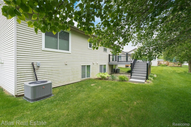 3527 Applewood Ln Unit 2, Grand Blanc, MI 48439 - view of grassy yard with stairs and a wooden deck