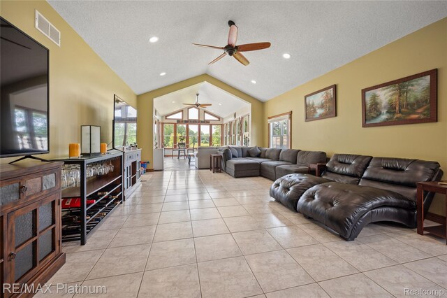 8922 Mcclements Rd, Brighton, MI 48114 - living area featuring a ceiling fan, light tile patterned floors, a textured ceiling, recessed lighting, and high vaulted ceiling
