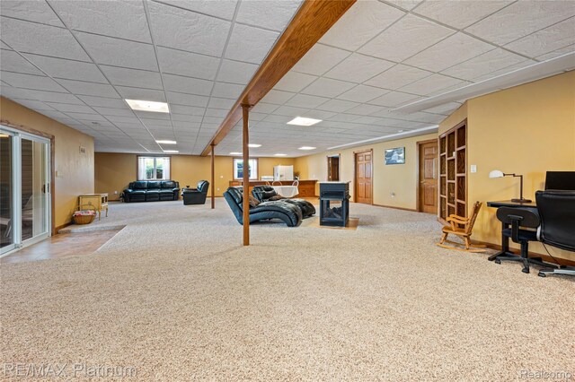 8922 Mcclements Rd, Brighton, MI 48114 - living area with a desk, a paneled ceiling, and carpet floors